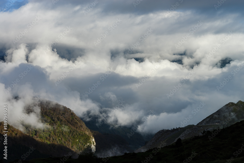 Over the clouds in high mountains, Pyrenees, foggy and cloudy