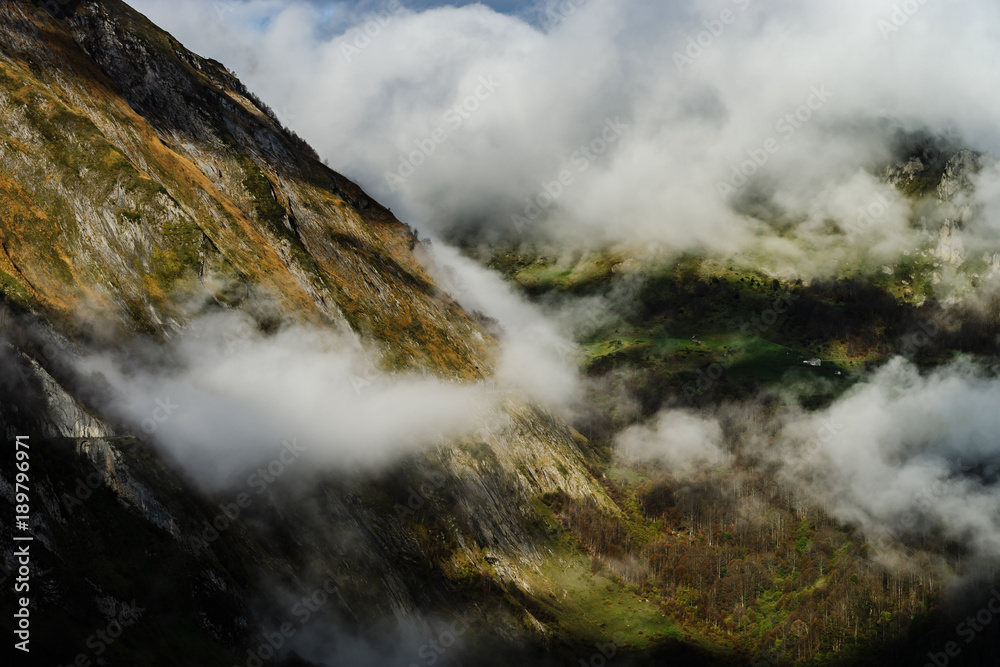 Over the clouds in high mountains, Pyrenees, foggy and cloudy