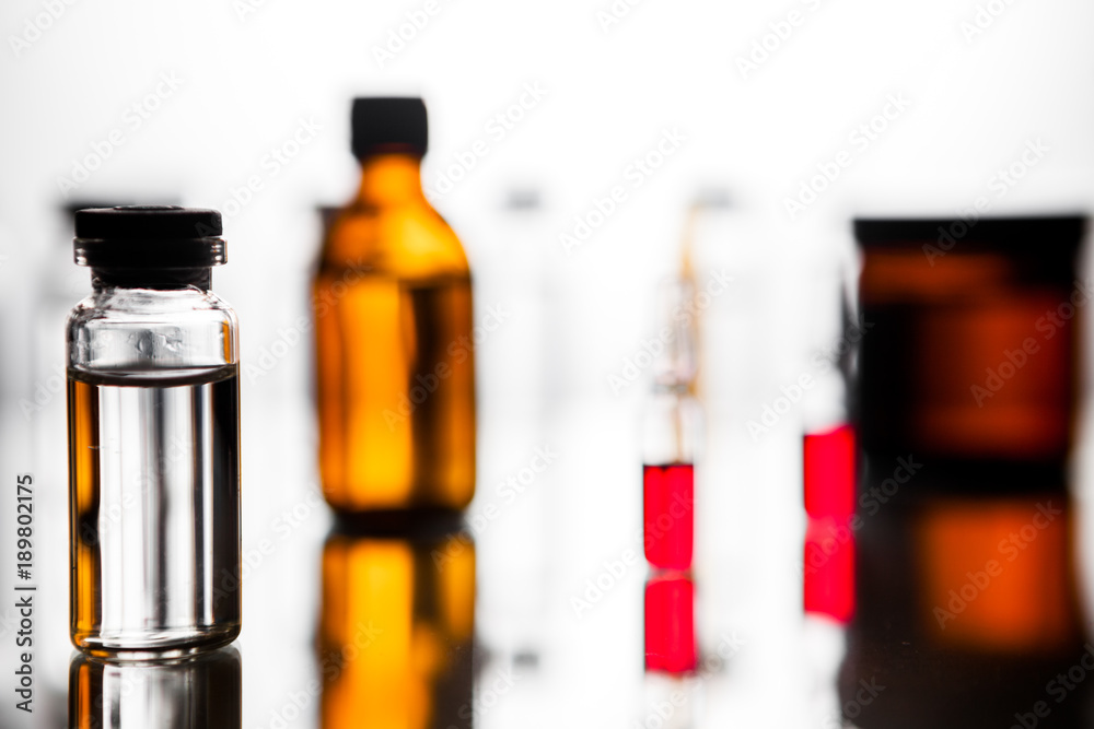 Group of ampoules with a transparent medicine in medical laboratory Group of ampoules with a transparent medicine in medical laboratory