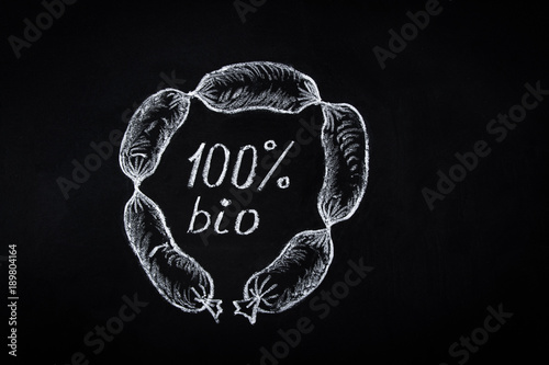 Fotografie Hand Drawn Chalk Illustration on Blackboard of Circle String of Frankfurter Sausages with Bio Lettering