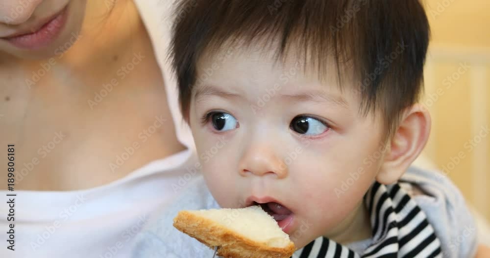 mother play pretend feeding toast with son mother play pretend feeding toast with son