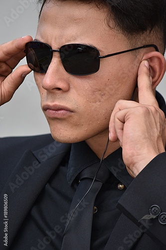 Hispanic Fbi Agent Listening Wearing Sunglasses Stock Photo | Adobe Stock