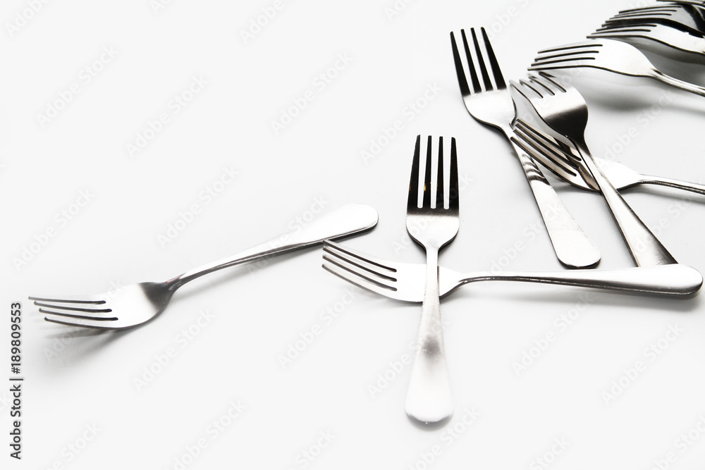 Fork background / A fork, in cutlery or kitchenware, is a tool consisting of a handle with several narrow tines on one end. Fork background / A fork, in cutlery or kitchenware, is a tool consisting of a handle with several narrow tines on one end.