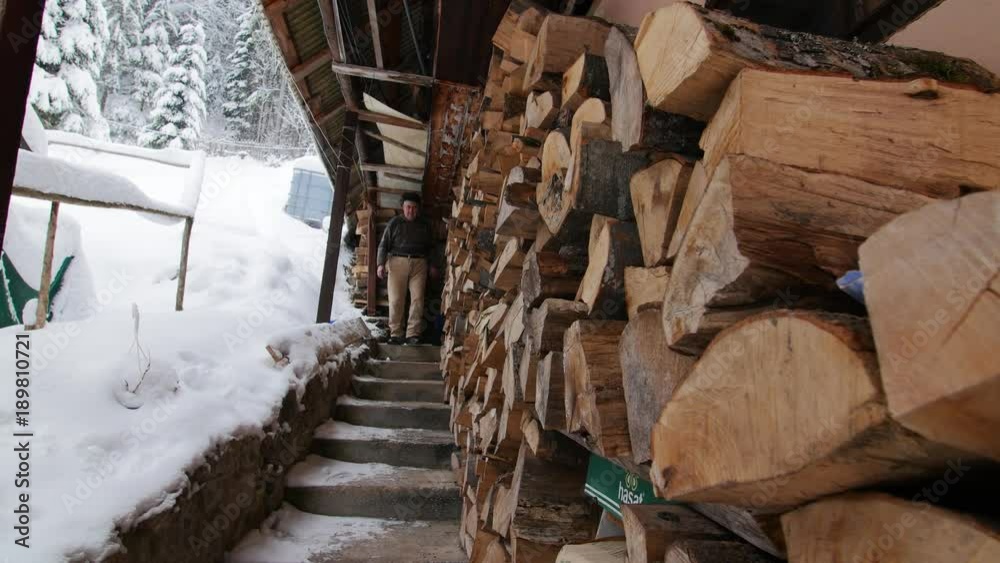 Old Man Walking Down The Stairs Of A Cabin In Winter Old Man Walking Down The Stairs Of A Cabin In Winter