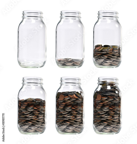 Image of step of pile of coins in glass jar for business, saving, growth, economic concept isolated on white background