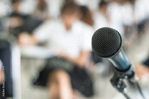 Microphone voice speaker with audiences or students in seminar classroom, lecture hall or conference meeting in educational business event for host, teacher, or coaching mentor