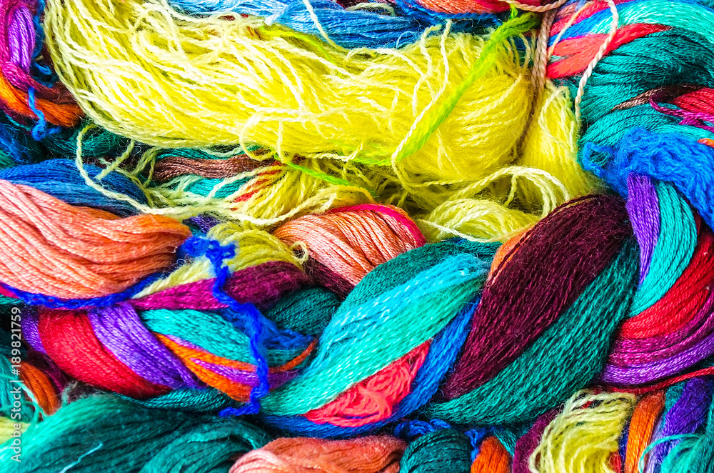 Bundles of home made colorful thread. A bundle of twisted colored