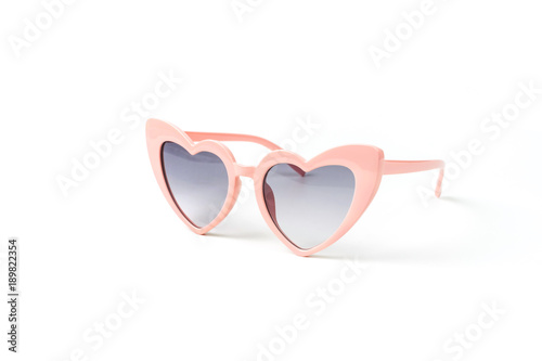 Pink heart shape sunglasses isolated