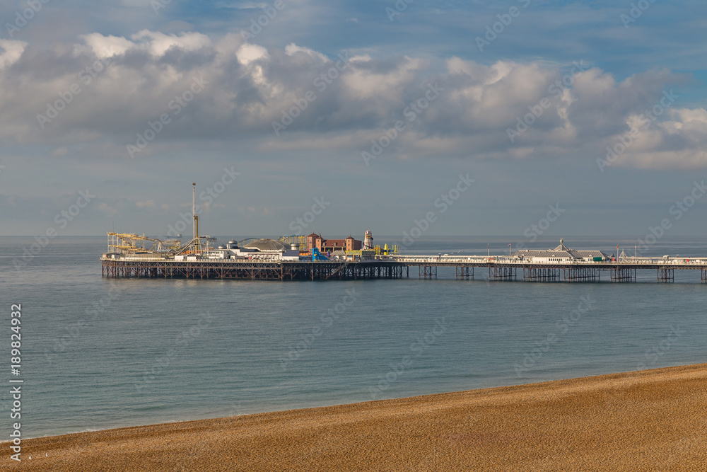 Clouds over the Brighton Pier and beach, East Sussex, UK