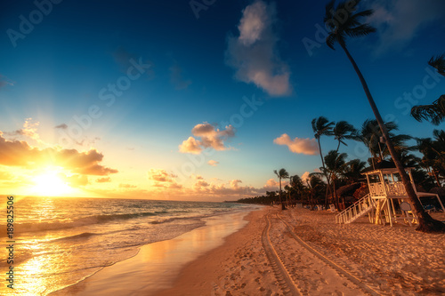 Caribbean vacation, beautiful sunrise over tropical beach. Punta Cana resort.