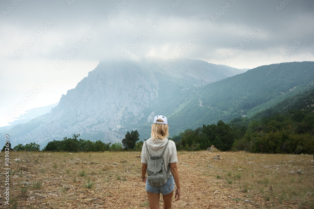 Girl hiking in mountains Girl hiking in mountains