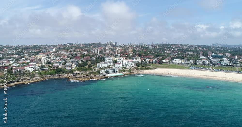 Panning in view of Bondi Beach Sydney the most famous beach off Eastern suburb on sunny summer day over Pacific waters.
Panning in view of Bondi Beach Sydney the most famous beach off Eastern suburb on sunny summer day over Pacific waters.