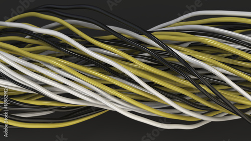 Twisted black, white and yellow cables and wires on black surface