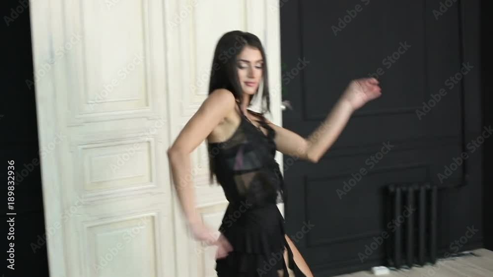 Slim dancer woman dancing rumba in dance studio Slim dancer woman dancing rumba in dance studio