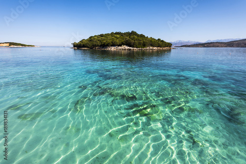 Ksamil Beach - Idyllic little island surrounded by incredible turquoise lonian sea, Ksamil, Albania, Europe photo