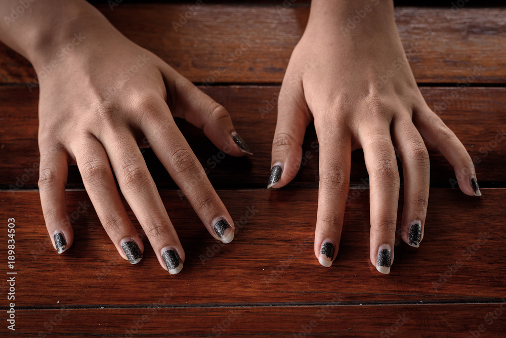 Human hands on the table with low key theme