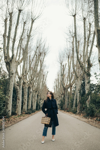 Pretty student woman in the park. Young student on tree path © Juanje Garrido