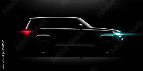 Realistic Off-road car full-size SUV lit in the dark photo
