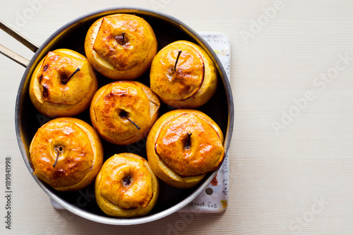 Baked apples with honey and cinnamon. The concept of a healthy diet without sugar and flour. Home recipe. photo