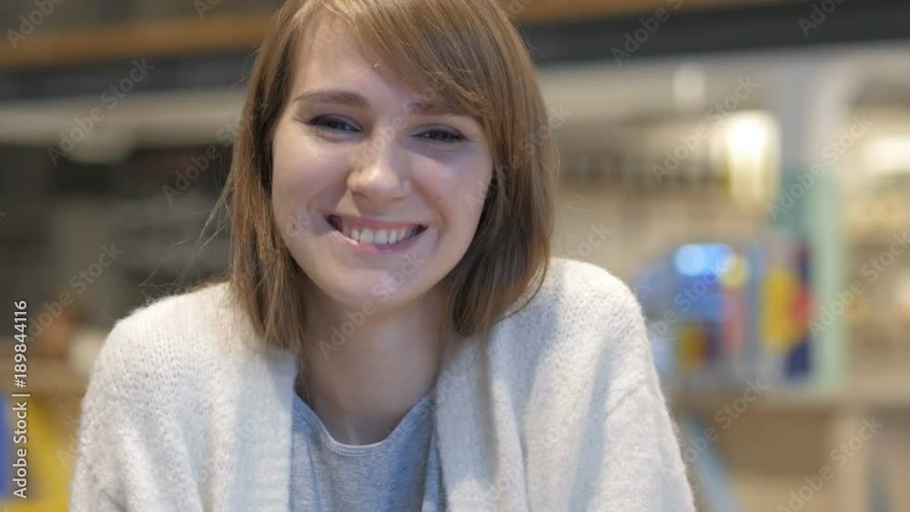 Portrait of Young Woman Inviting Customers in Cafe Portrait of Young Woman Inviting Customers in Cafe