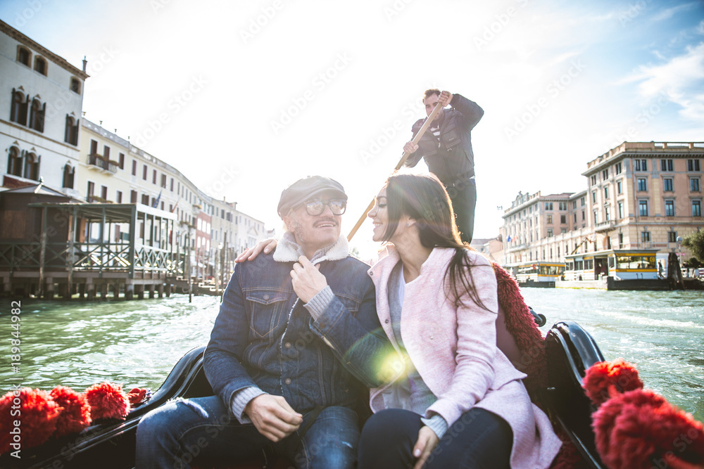 Couple sailing on venetian gondola