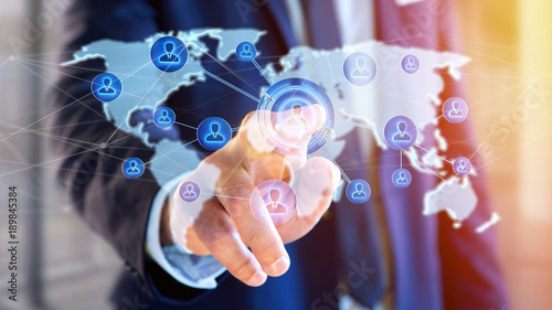 Businessman holding a Network over a connected world map - 3d render