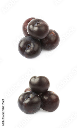 Pile of black plums isolated