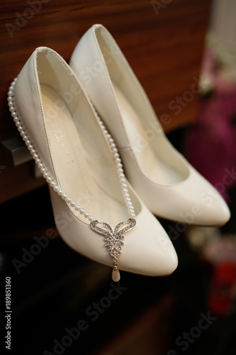 bridal shoes and pendant photo