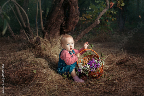 Girl with a basket of flowers.