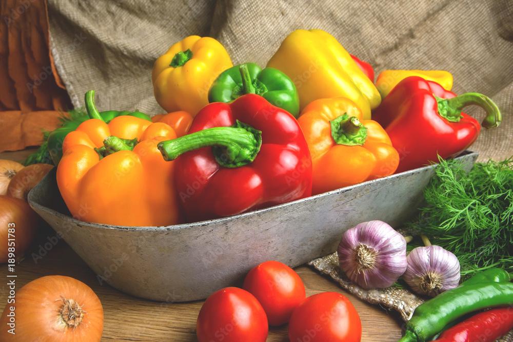 Red, green and yellow sweet bell peppers on table, Red, green and yellow sweet bell peppers on table,
