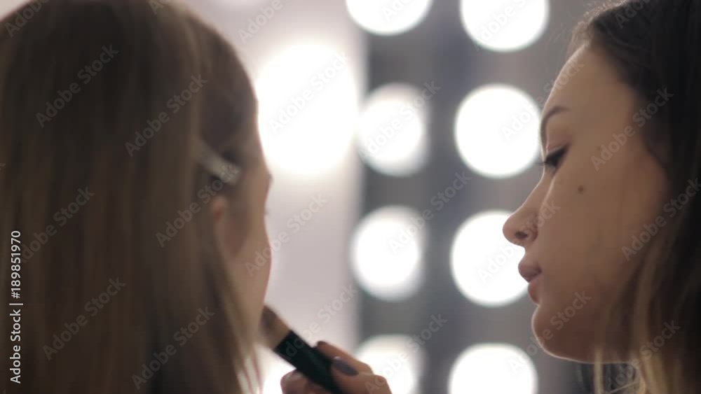 Professional makeup artist and hairstylist creates a beautiful image for a beautiful young girl. Professional makeup artist and hairstylist creates a beautiful image for a beautiful young girl.