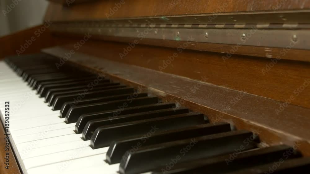 A slide and a short riff played on an old piano A slide and a short riff played on an old piano