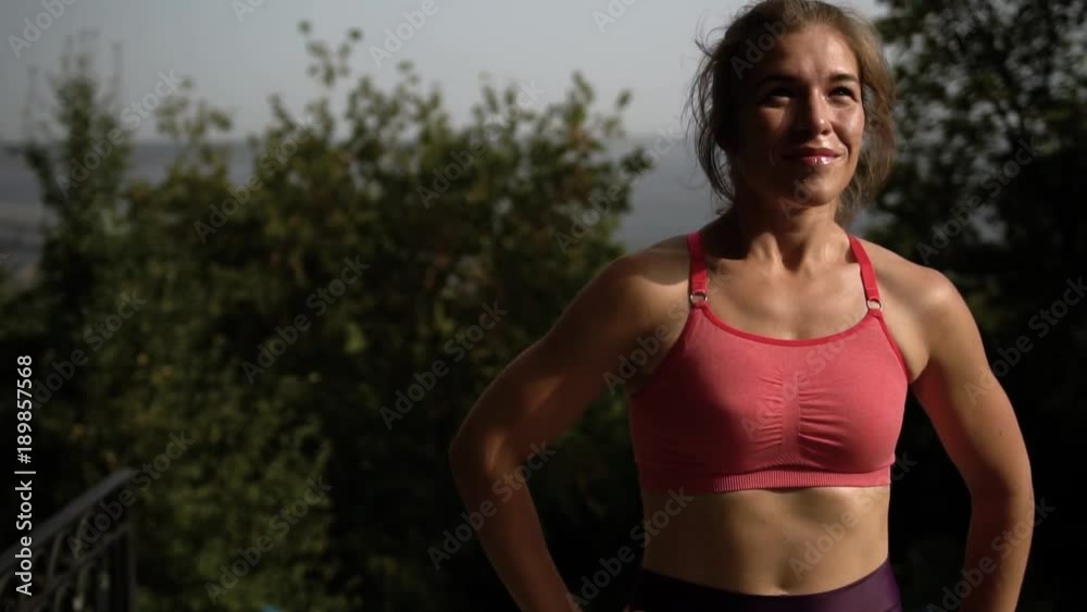 Portrait Of Beautiful Young Athlete Resting After A Long Workout And Rejoicing Result In Sunny Summer Day In The Park Portrait Of Beautiful Young Athlete Resting After A Long Workout And Rejoicing Result In Sunny Summer Day In The Park
