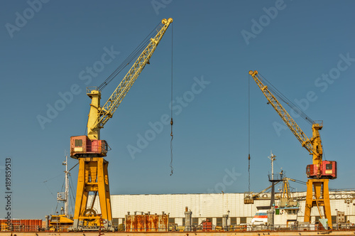 Two cranes on port pier