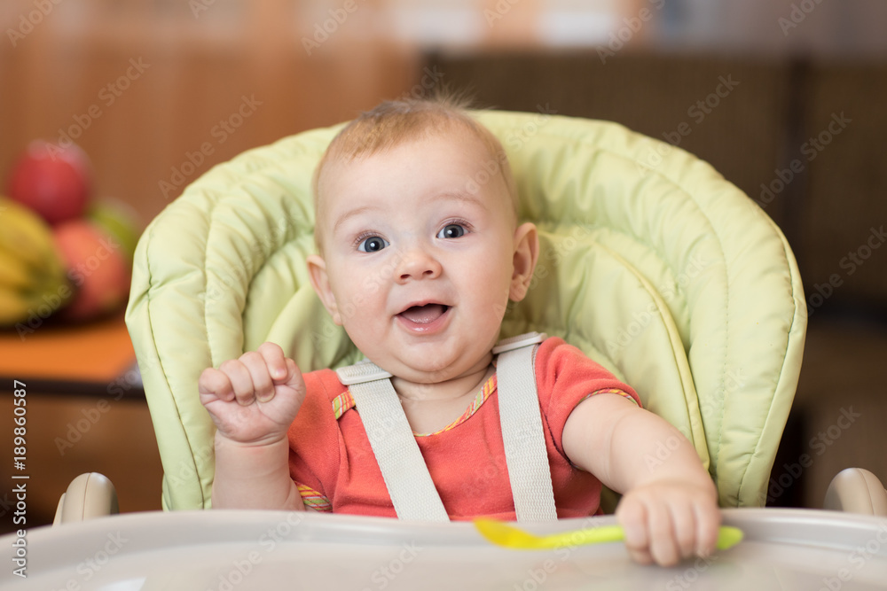 Baby ready to eat in the highchair Baby ready to eat in the highchair
