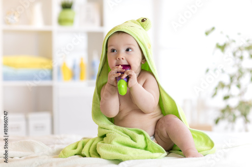 Little baby in green towel ...