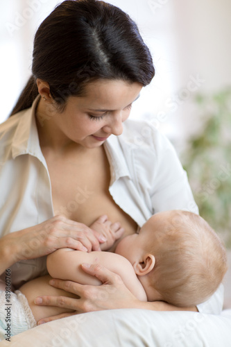 Young mother holding her ne...