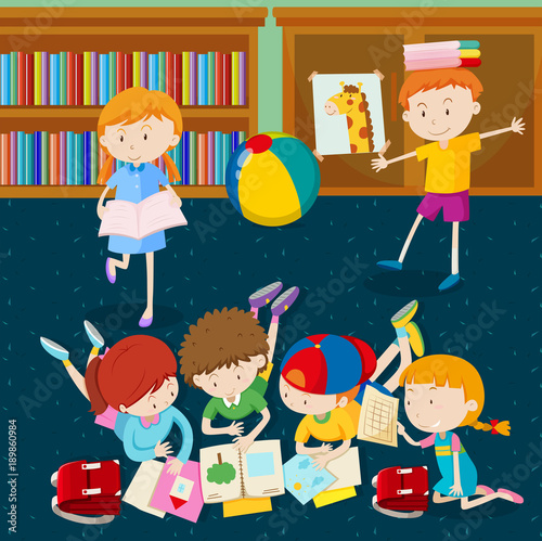 Children reading books in classroom