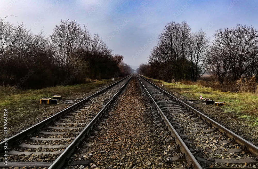 Landscape of railway rails in foggy weather