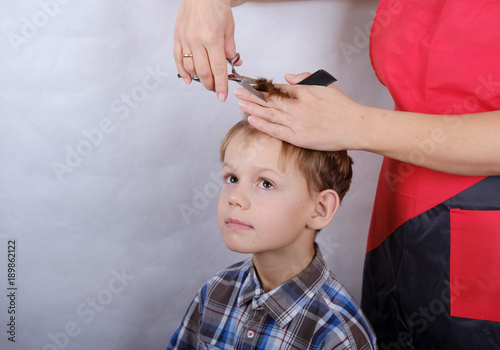 boy haircut with scissors