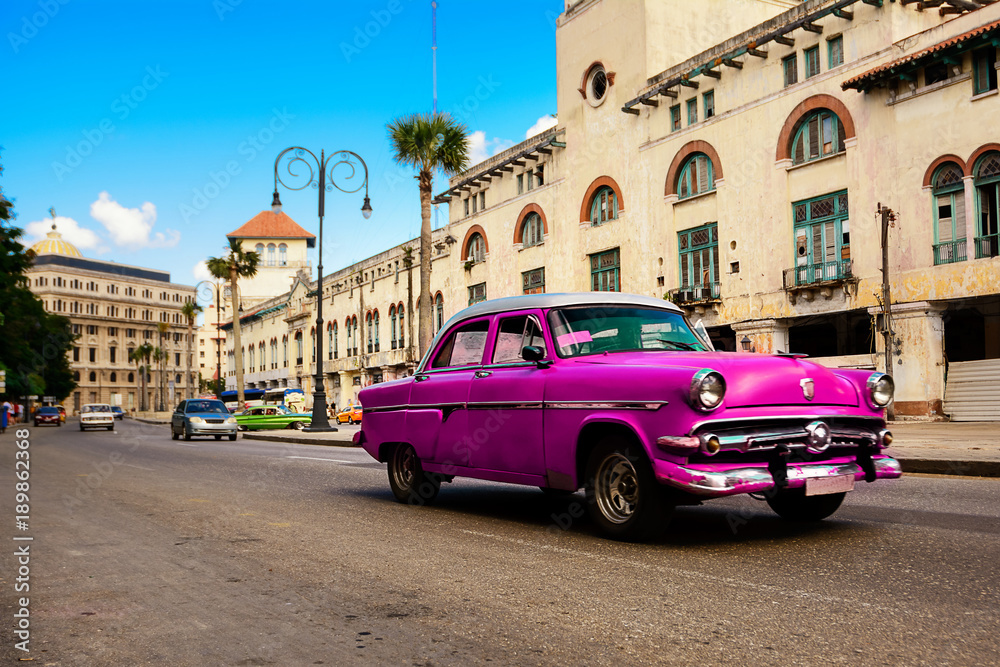 Rose old american classical car in road of old Havana (Cuba)