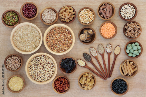 Macrobiotic diet health food concept with cereals, grains, legumes, seeds, wasabi nuts, seaweed, whole wheat pasta and vegetables with foods high in fibre, antioxidants and minerals. 