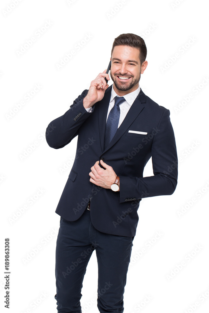 Happy young stylish businessman calling by phone isolated on white Happy young stylish businessman calling by phone isolated on white