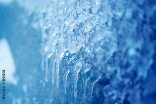 Photo background of bright icicles and ice floes