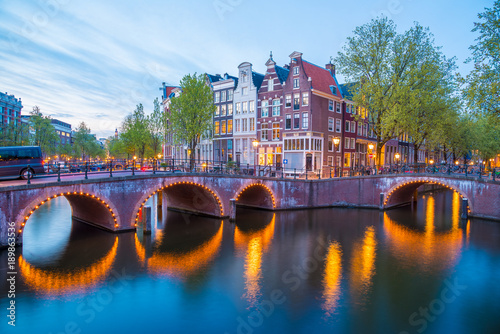 Fototapeta Naklejka Na Ścianę i Meble -  Bridge over Emperor's canal in Amsterdam, The Netherlands at twilight. HDR image