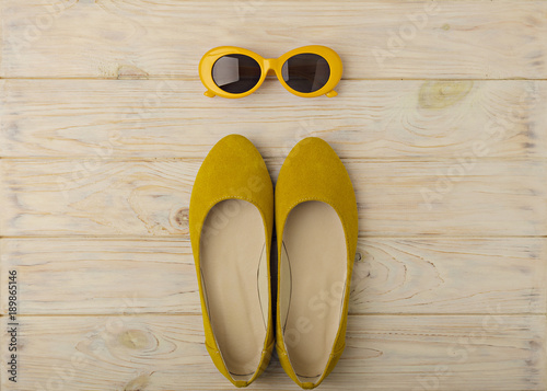 Women's ballet flats and sunglasses are yellow color.