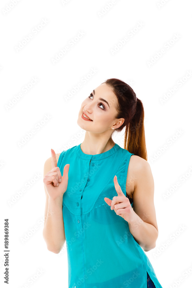 Woman showing something up above her with her finger isolated on white background Woman showing something up above her with her finger isolated on white background