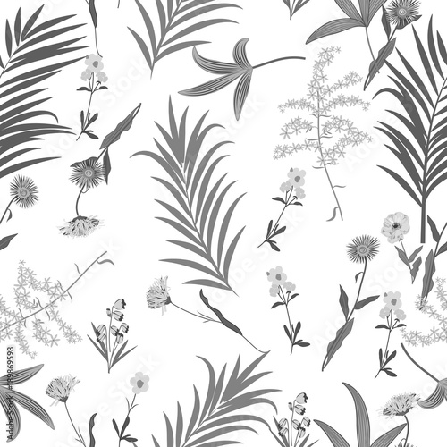 Seamless vector pattern of tropical leaves of palm tree and flowers