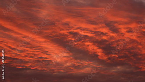 Red cloudy sky at sunrise.
