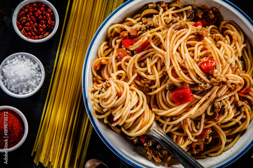 Spaghetti with meat, tomato sauce and vegetables 